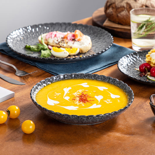 vancasso Chrys 12-Piece Stoneware Dinnerware Set in Grey with a gloss finish and embossed chrysanthemum patterns, blending rustic charm with a modern feel to elevate both casual and formal dining settings.