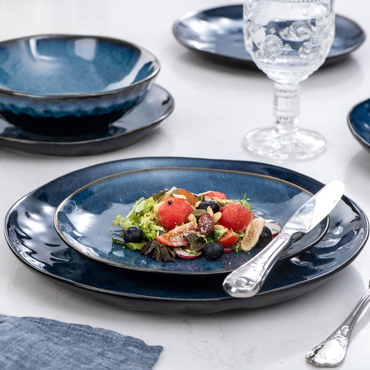 vancasso Starry 12-Piece Stoneware Dinnerware Set in Blue, Featuring a Glossy Finish and Reactive Glaze, Ideal for Both Casual Meals and Special Occasions.