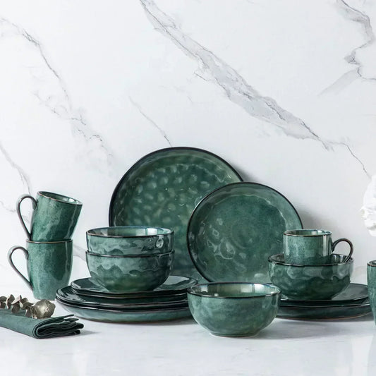 vancasso Starry 16-Piece Green Stoneware Dinnerware Set With A Unique Double-Sided Reactive Glaze, Showcasing Organic Shapes, Richly Textured Finishes, And Retro-Inspired Dark Tones.