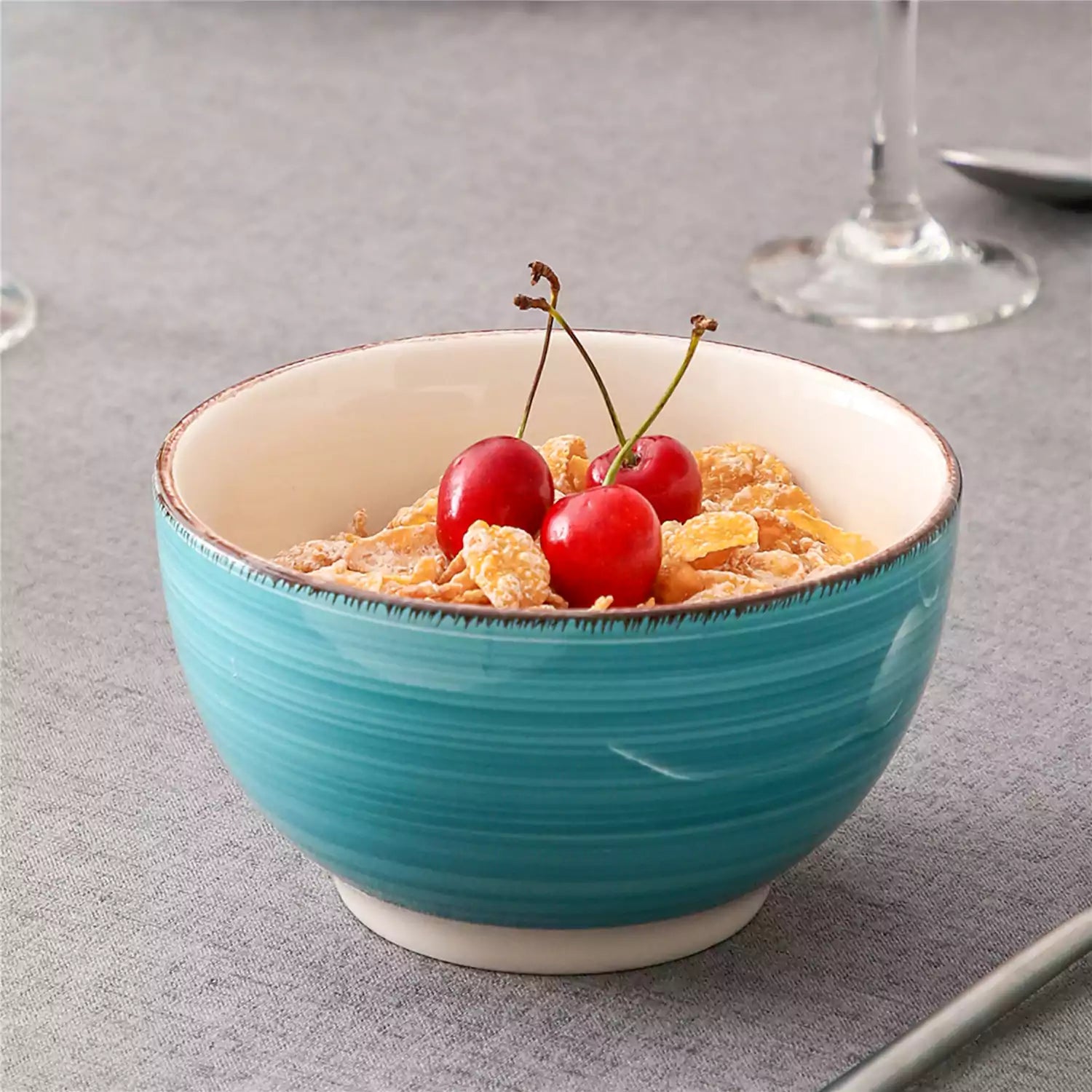 Bella Cereal Bowl Set of 4 in Turquoise with spiral and speckled design - filled with fruit oatmeal-vancasso