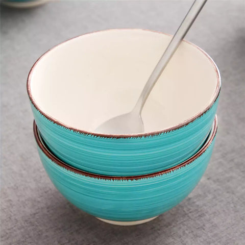 Bella Cereal Bowl Set of 4 in Turquoise with spiral and speckled design - filled with fruit oatmeal-vancasso