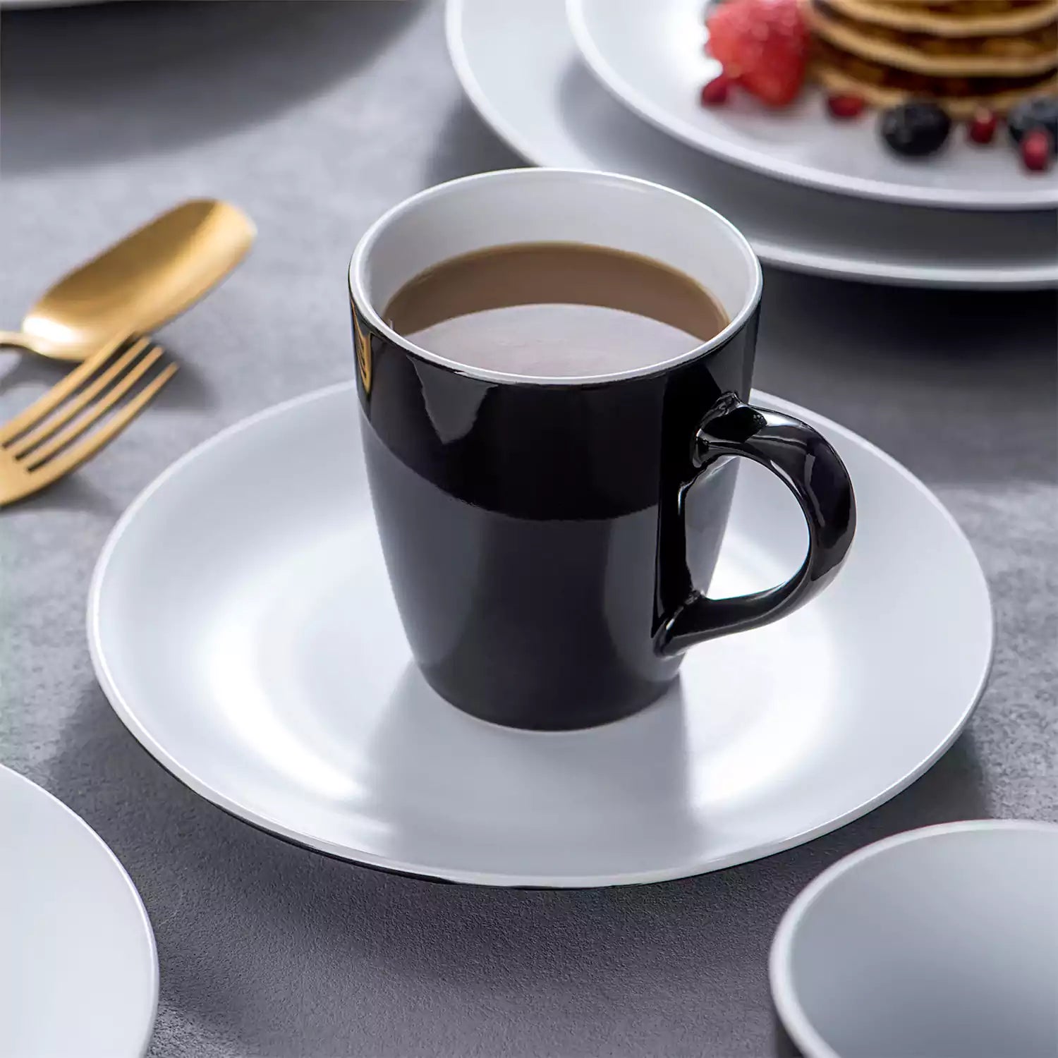 Lento 16 Piece Dinnerware Set in White - featuring matte stoneware with modern black and white design - including plates, bowls, and mugs for a sleek - minimalist table setting-vancasso