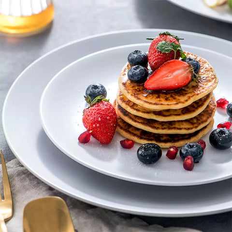 Lento 16 Piece Dinnerware Set in White - featuring matte stoneware with modern black and white design - including plates, bowls, and mugs for a sleek - minimalist table setting-vancasso