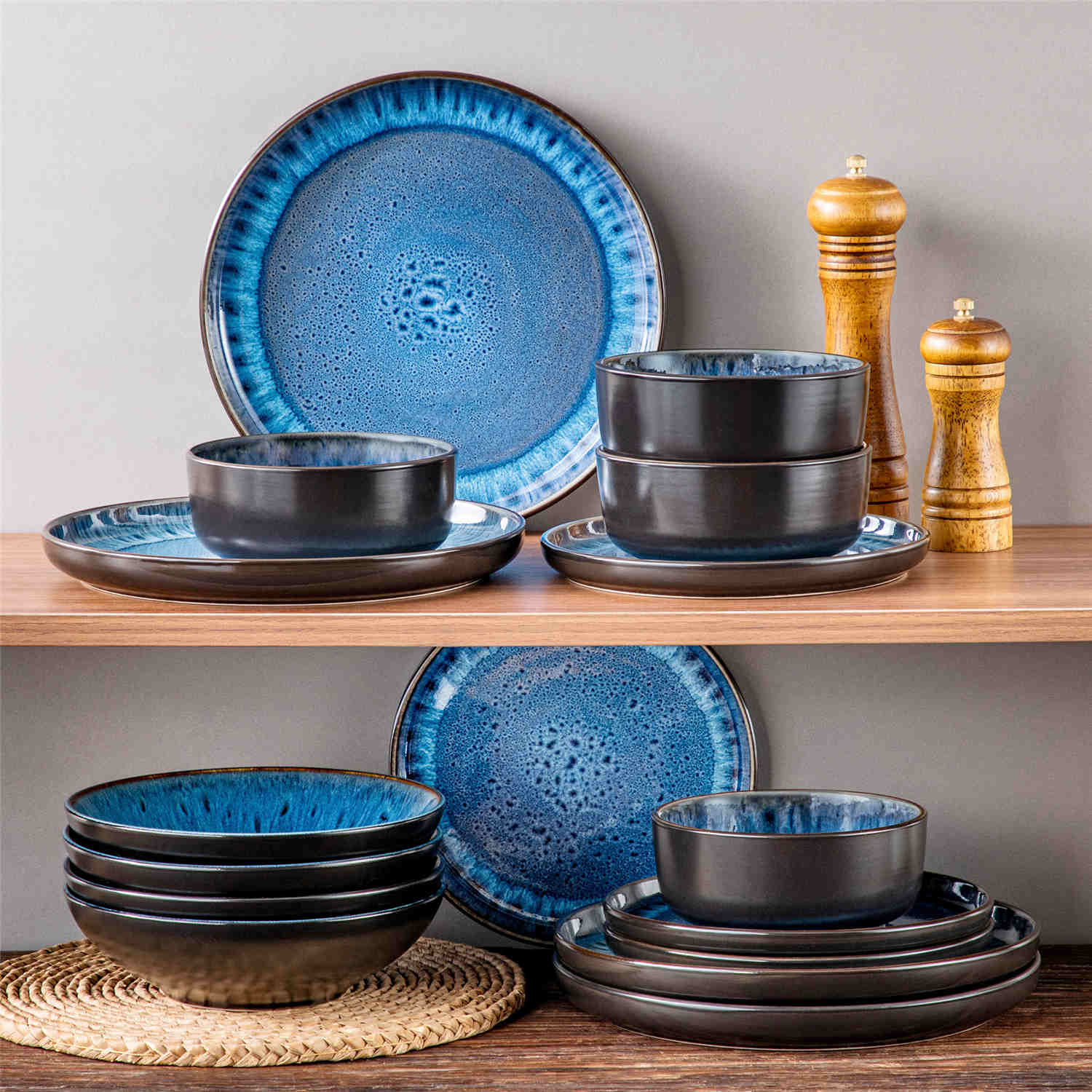 A glossy blue 16-piece stoneware dinnerware set from the Playa collection - featuring farmhouse charm with plates and bowls for 4 people-vancasso