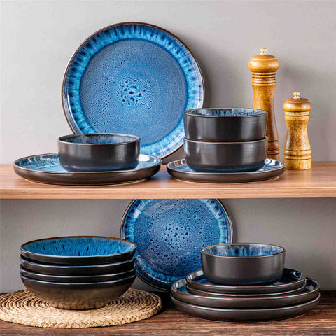 A glossy blue 16-piece stoneware dinnerware set from the Playa collection - featuring farmhouse charm with plates and bowls for 4 people-vancasso