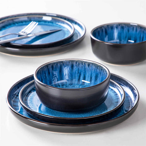 Playa 18-Piece Stoneware Dinnerware Set with plates and bowls for 6 - featuring a unique blue reactive glaze and a farmhouse-inspired style-vancasso