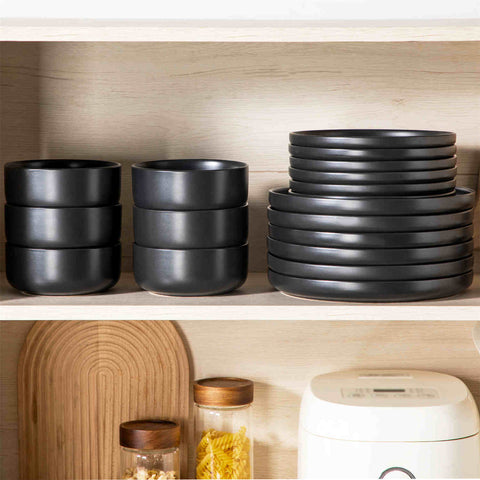 Playa 18-Piece Stoneware Dinnerware Set for 6, featuring plates and bowls in a modern Ibiza-inspired style with a matte black finish-vancasso