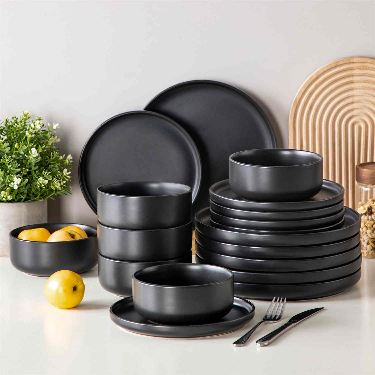 Playa 18-Piece Stoneware Dinnerware Set for 6, featuring plates and bowls in a modern Ibiza-inspired style with a matte black finish-vancasso