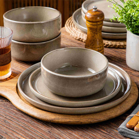 Playa 12-Piece Stoneware Dinnerware Set with plates and bowls for 4 - featuring a unique blue reactive brown and a farmhouse-inspired style-vancasso