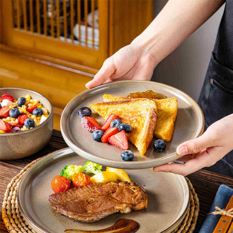 Playa 12-Piece Stoneware Dinnerware Set with plates and bowls for 4 - featuring a unique blue reactive brown and a farmhouse-inspired style-vancasso