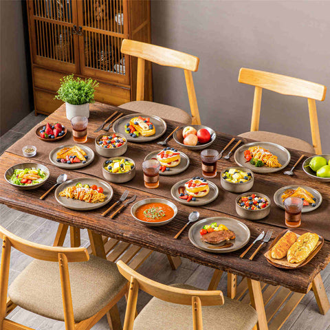 A glossy brown 16-piece stoneware dinnerware set from the Playa collection - featuring farmhouse charm with plates and bowls for 4 people-vancasso