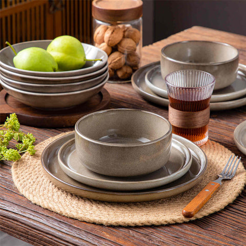 A glossy brown 16-piece stoneware dinnerware set from the Playa collection - featuring farmhouse charm with plates and bowls for 4 people-vancasso