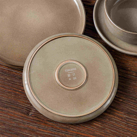 A glossy brown 16-piece stoneware dinnerware set from the Playa collection - featuring farmhouse charm with plates and bowls for 4 people-vancasso