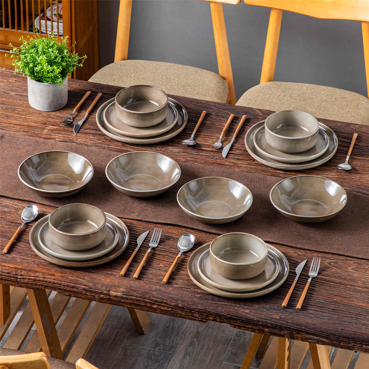 A glossy brown 16-piece stoneware dinnerware set from the Playa collection - featuring farmhouse charm with plates and bowls for 4 people-vancasso