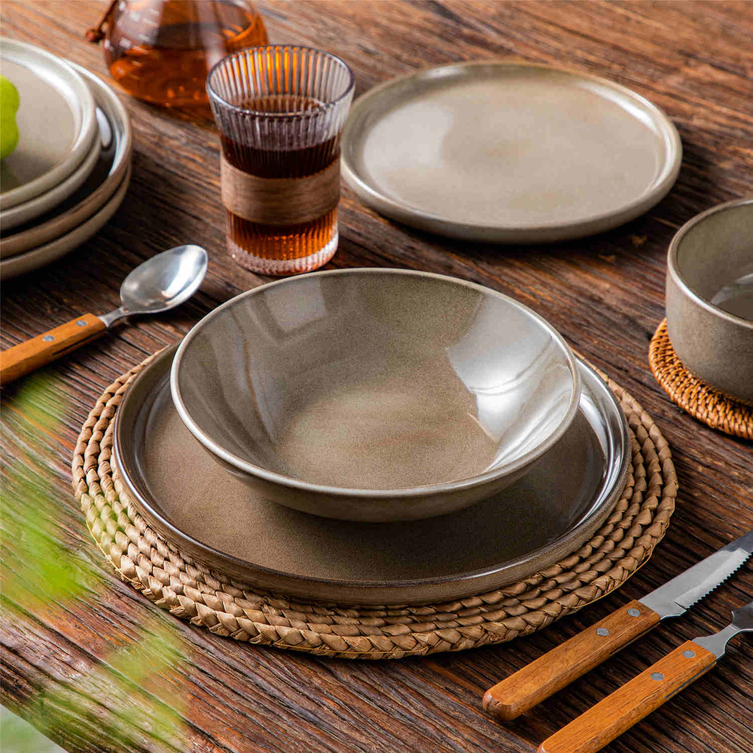 A glossy brown 16-piece stoneware dinnerware set from the Playa collection - featuring farmhouse charm with plates and bowls for 4 people-vancasso