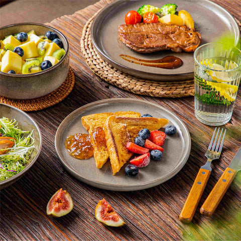 A glossy brown 16-piece stoneware dinnerware set from the Playa collection - featuring farmhouse charm with plates and bowls for 4 people-vancasso