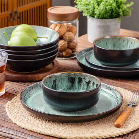 A glossy dark green 16-piece stoneware dinnerware set from the Playa collection - featuring farmhouse charm with plates and bowls for 4 people-vancasso