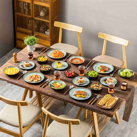 A glossy dark green 16-piece stoneware dinnerware set from the Playa collection - featuring farmhouse charm with plates and bowls for 4 people-vancasso