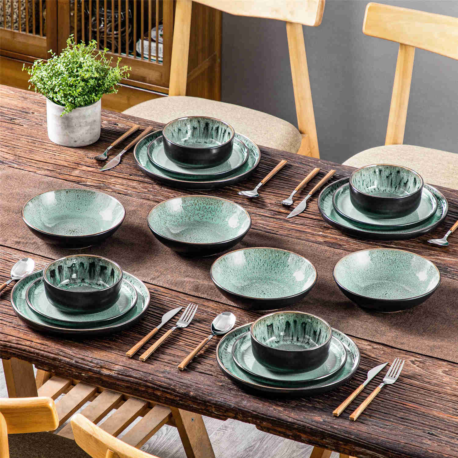 A glossy dark green 16-piece stoneware dinnerware set from the Playa collection - featuring farmhouse charm with plates and bowls for 4 people-vancasso