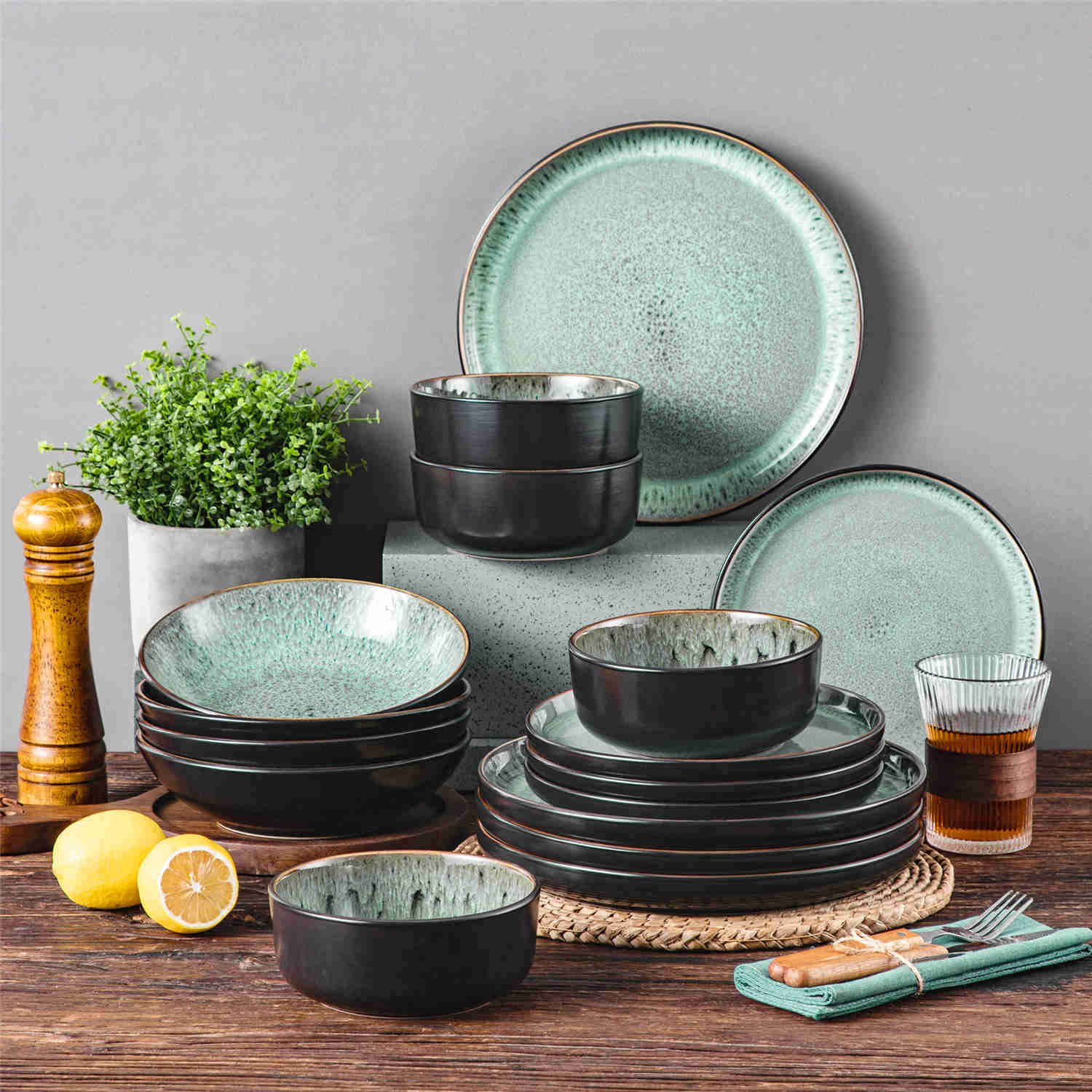 A glossy dark green 16-piece stoneware dinnerware set from the Playa collection - featuring farmhouse charm with plates and bowls for 4 people-vancasso