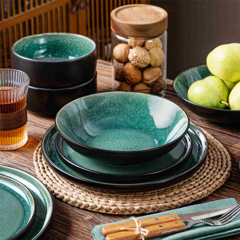 A glossy green 16-piece stoneware dinnerware set from the Playa collection - featuring farmhouse charm with plates and bowls for 4 people-vancasso