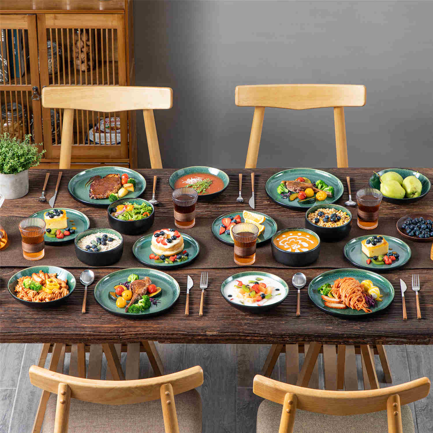 A glossy green 16-piece stoneware dinnerware set from the Playa collection - featuring farmhouse charm with plates and bowls for 4 people-vancasso