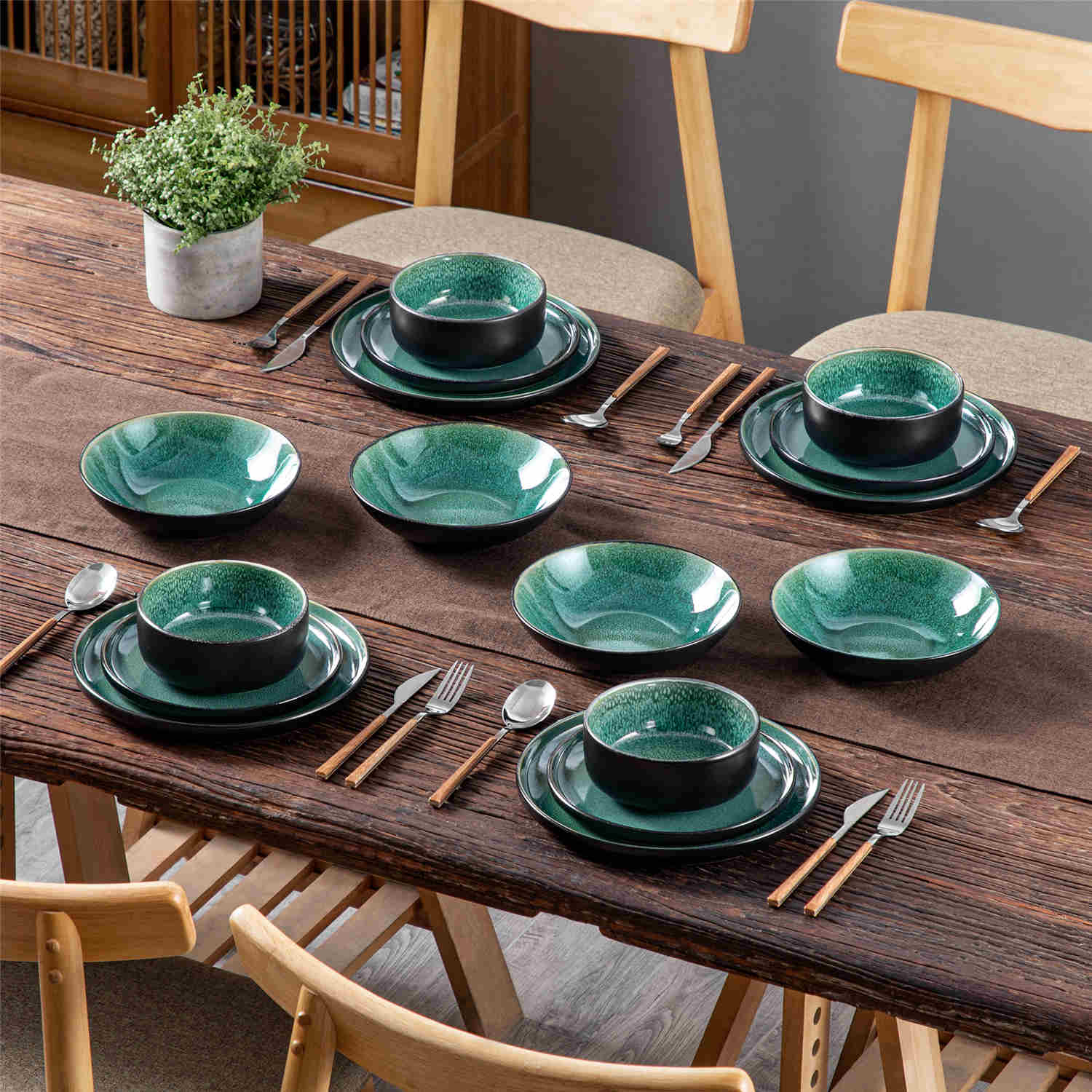 A glossy green 16-piece stoneware dinnerware set from the Playa collection - featuring farmhouse charm with plates and bowls for 4 people-vancasso