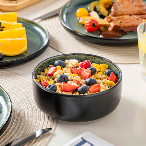 Playa 18-Piece Stoneware Dinnerware Set with plates and bowls for 6 - featuring a unique green reactive glaze and a farmhouse-inspired style-vancasso