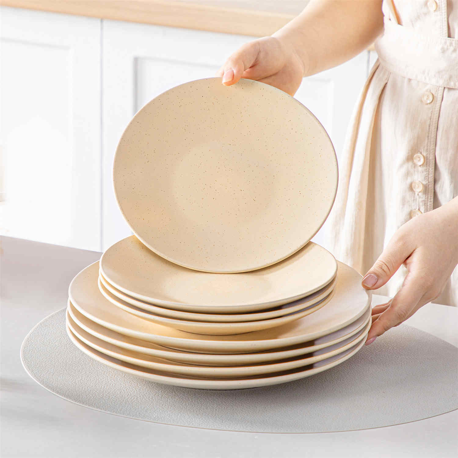 The Sabine 12-Piece Stoneware Dinnerware Set features a semi-matte finish and a modern round design in beige - providing service for 4 with both plates and bowls-vancasso