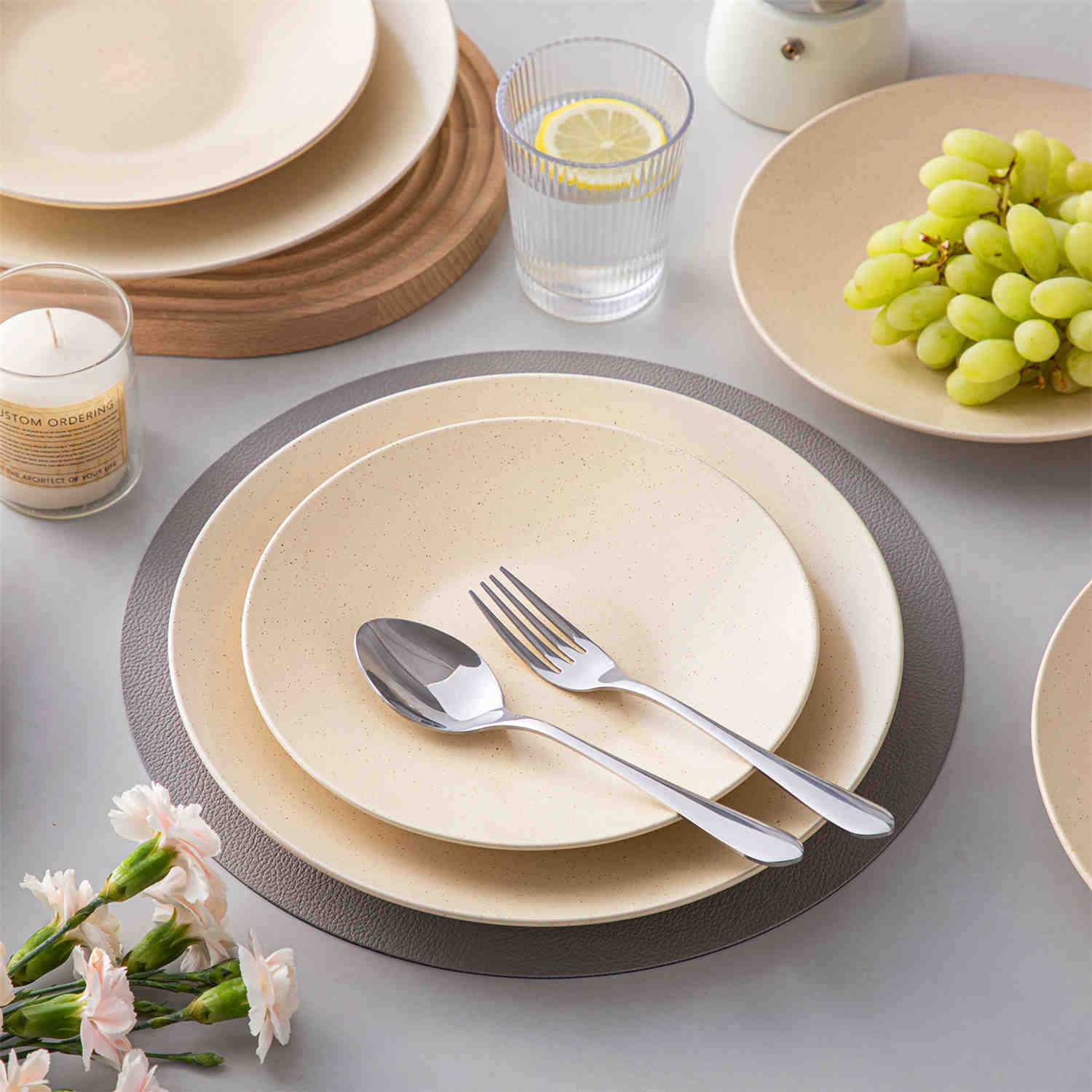 The Sabine 12-Piece Stoneware Dinnerware Set features a semi-matte finish and a modern round design in beige - providing service for 4 with both plates and bowls-vancasso