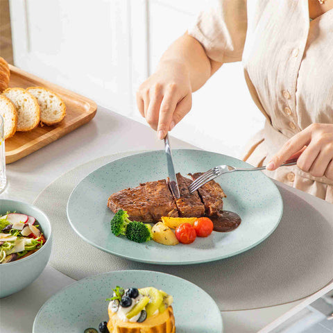 The Sabine 12-Piece Stoneware Dinnerware Set features a semi-matte finish and a modern round design in light grey - providing service for 4 with both plates and bowls-vancasso