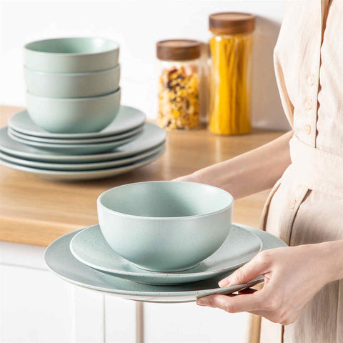 The Sabine 12-Piece Stoneware Dinnerware Set features a semi-matte finish and a modern round design in light grey - providing service for 4 with both plates and bowls-vancasso