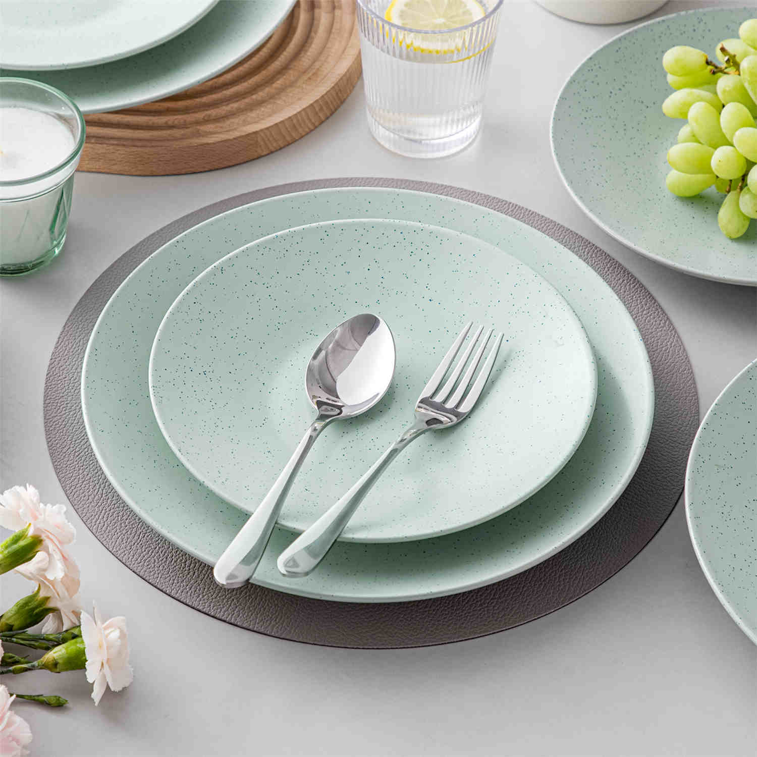 The Sabine 12-Piece Stoneware Dinnerware Set features a semi-matte finish and a modern round design in light grey - providing service for 4 with both plates and bowls-vancasso