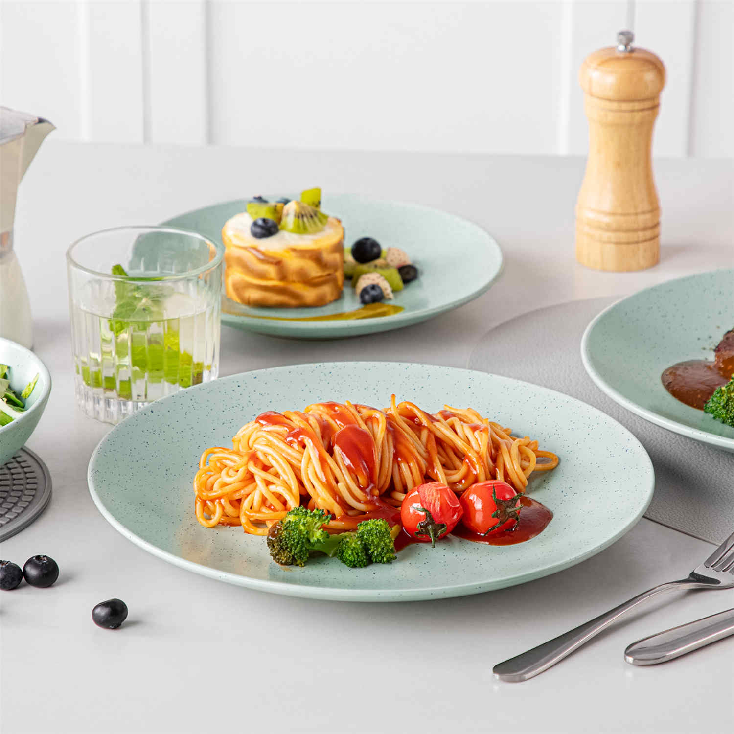 The Sabine 12-Piece Stoneware Dinnerware Set features a semi-matte finish and a modern round design in light grey - providing service for 4 with both plates and bowls-vancasso