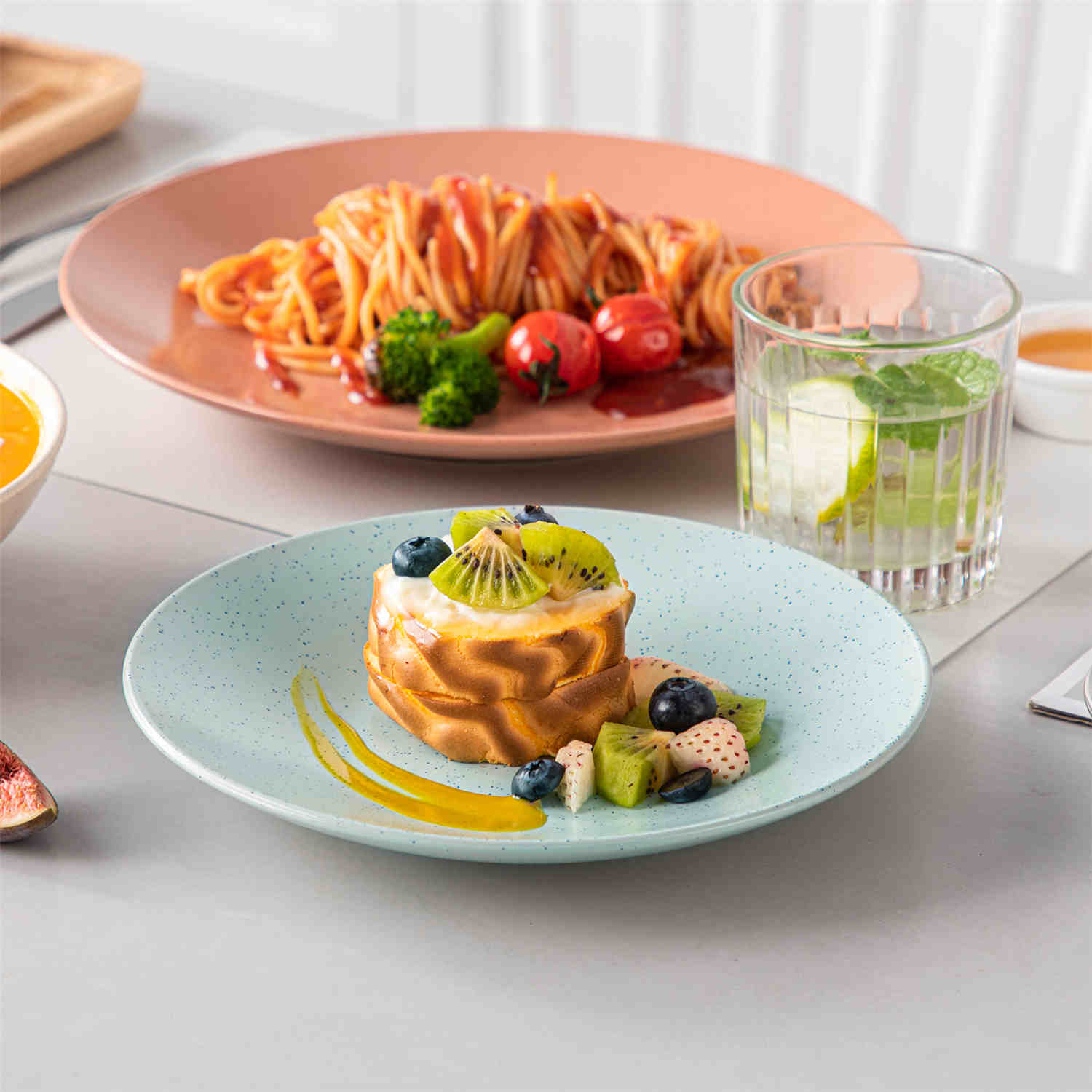 The Sabine 12-Piece Stoneware Dinnerware Set features a semi-matte finish and a modern round design in multicolor - providing service for 4 with both plates and bowls-vancasso