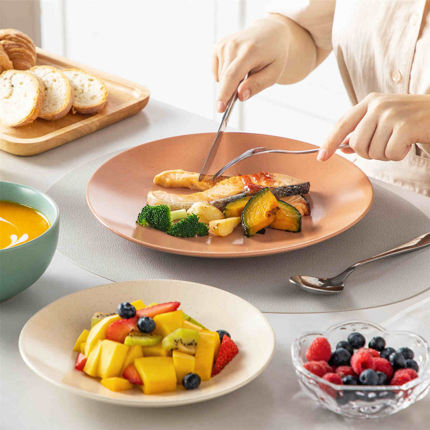 The Sabine 12-Piece Stoneware Dinnerware Set features a semi-matte finish and a modern round design in multicolor - providing service for 4 with both plates and bowls-vancasso