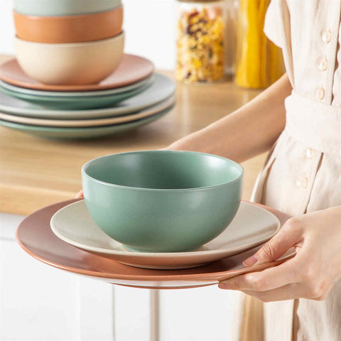 The Sabine 12-Piece Stoneware Dinnerware Set features a semi-matte finish and a modern round design in multicolor - providing service for 4 with both plates and bowls-vancasso