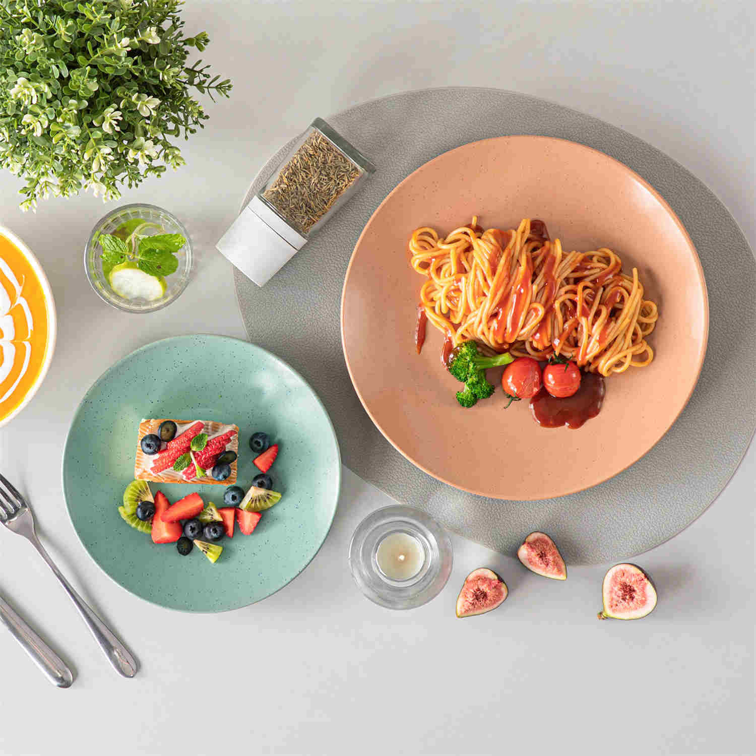 The Sabine 12-Piece Stoneware Dinnerware Set features a semi-matte finish and a modern round design in multicolor - providing service for 4 with both plates and bowls-vancasso