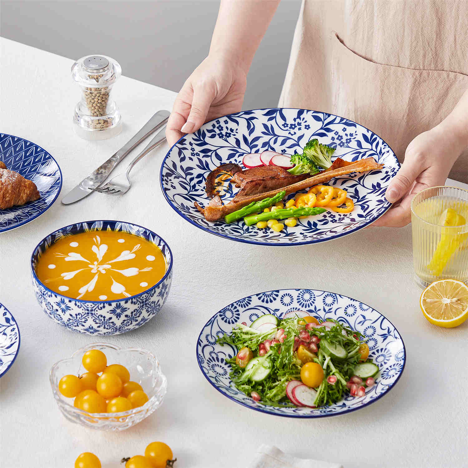 Selene 12-Piece Porcelain Dinnerware Set with blue and white glaze and Japanese-inspired design, including matching plates and bowls-vancasso