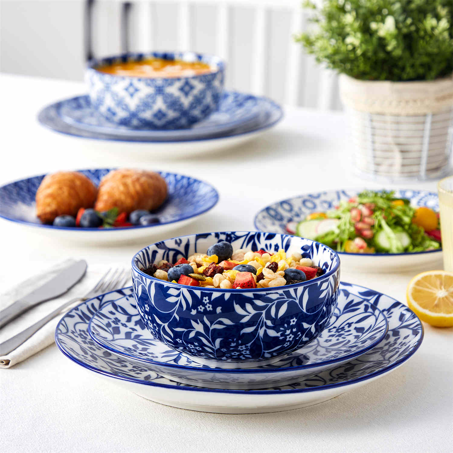 Selene 12-Piece Porcelain Dinnerware Set with blue and white glaze and Japanese-inspired design, including matching plates and bowls-vancasso