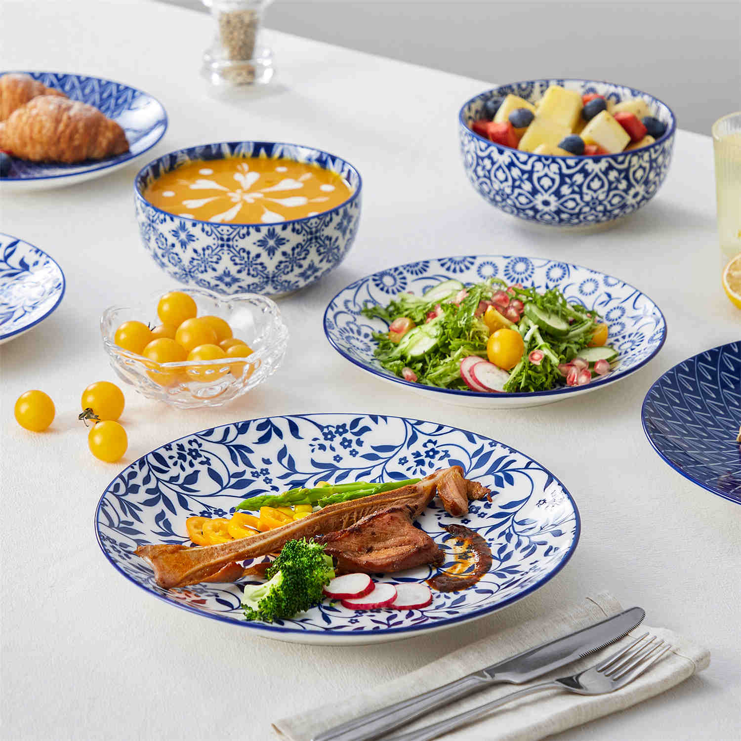 Selene 12-Piece Porcelain Dinnerware Set with blue and white glaze and Japanese-inspired design, including matching plates and bowls-vancasso