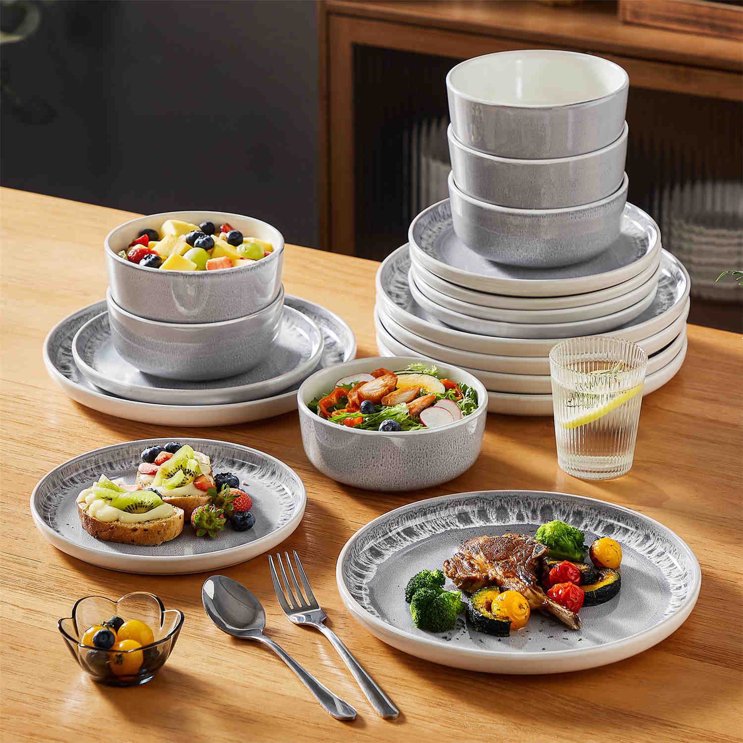 Snow 18-Piece Stoneware Dinnerware Set featuring a Mediterranean-inspired design with a unique snowflake glaze - serving pieces that add charm to any dining table - Grey - vancassso