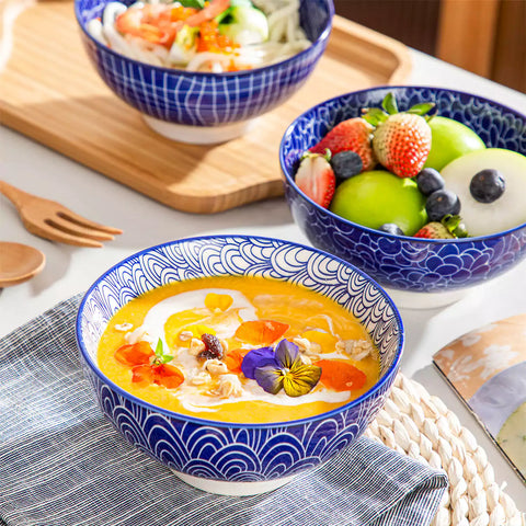 Takaki Cereal Bowls Set of 4 featuring geometric floral patterns in deep navy blue - offering a chic Japanese-inspired touch, filled with hearty oatmeal-vancasso