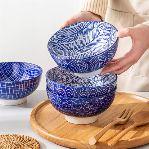 Takaki Cereal Bowls Set of 4 featuring geometric floral patterns in deep navy blue - offering a chic Japanese-inspired touch, filled with hearty oatmeal-vancasso