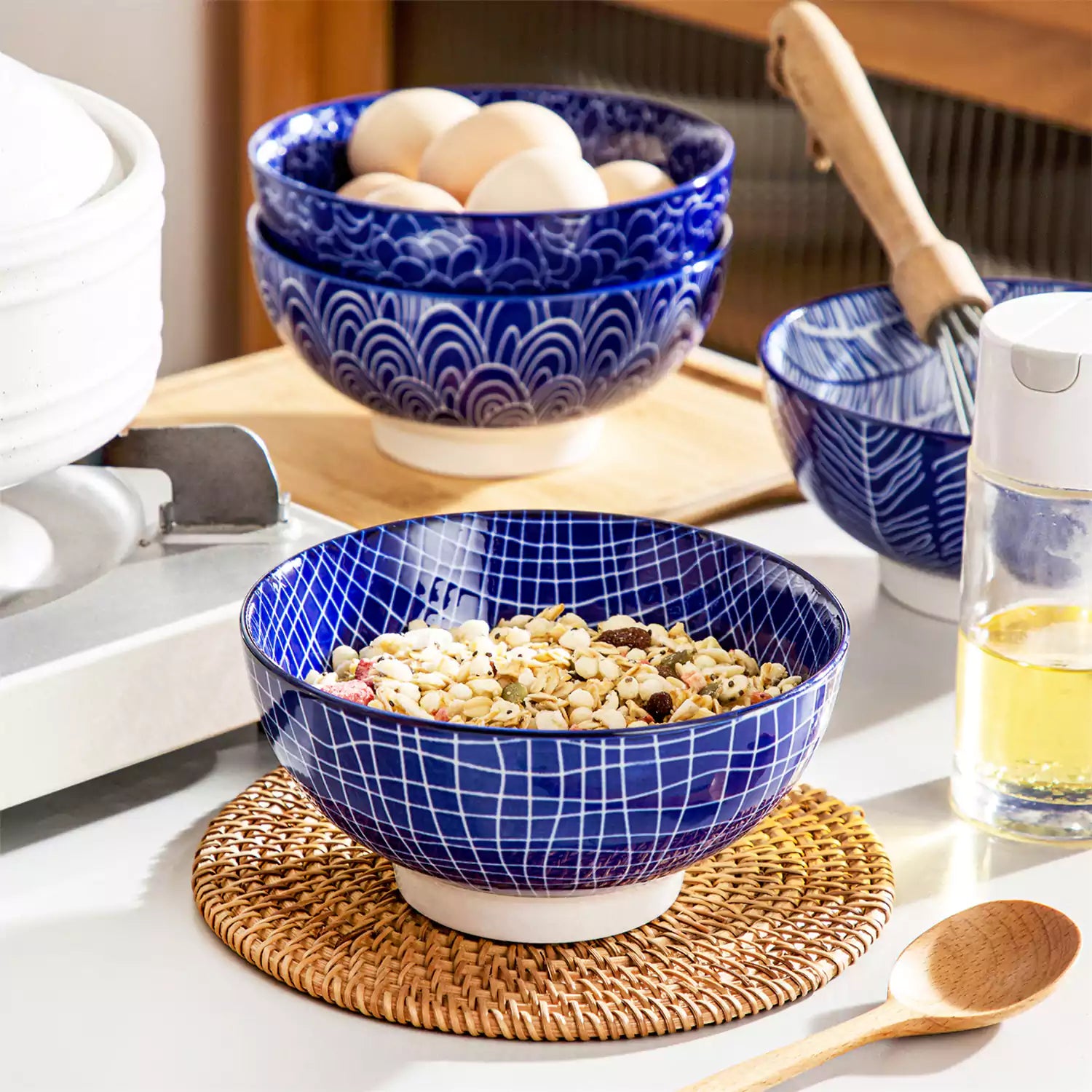 Takaki Cereal Bowls Set of 4 featuring geometric floral patterns in deep navy blue - offering a chic Japanese-inspired touch, filled with hearty oatmeal-vancasso