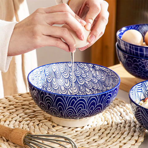 Takaki Cereal Bowls Set of 4 featuring geometric floral patterns in deep navy blue - offering a chic Japanese-inspired touch, filled with hearty oatmeal-vancasso