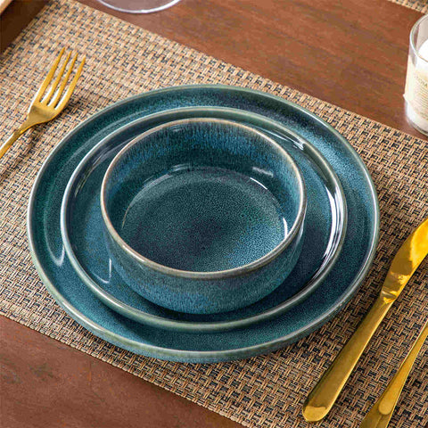 Vega 12-Piece Dinnerware Set in blue stoneware with reactive glaze - featuring farmhouse charm - includes plates and bowls for 3-vancasso