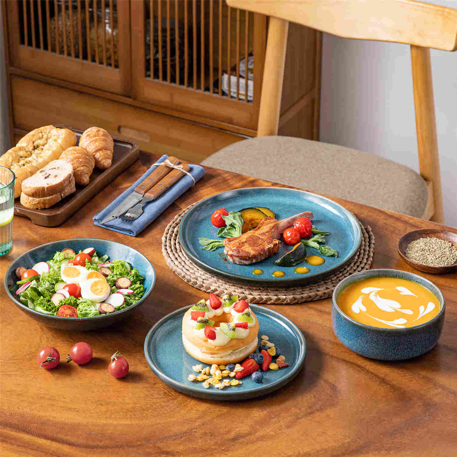 vancasso Vega 16-Piece Stoneware Dinnerware Set, Showcasing a Stunning Reactive Glaze Finish that Creates Unique, Vibrant Patterns on Each Piece. Featuring Dual-Sided Kiln Transformations, This Set Adds Depth and Character to Your Table Setting.